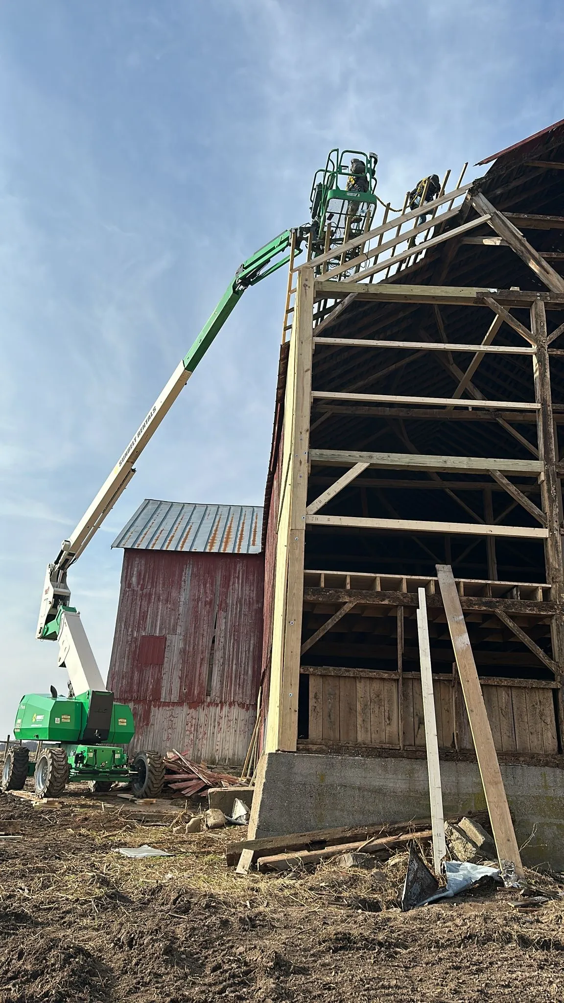 Barn frame reinforced during restoration