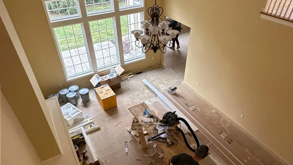 Vaulted great room during renovation, wide view